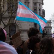 The lawsuit is being seen as a trial case amid national debate around trans inclusion in same-sex spaces