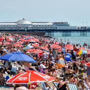 Thousands gathered on Brighton beach as temperatures soared across the Sussex coast