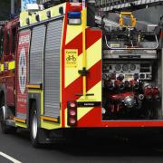 Fire service are responding to an overturned lorry catching fire in Balcombe