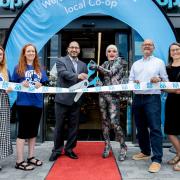 Alfie Ordinary, third right, alongside Ferhat Spurling, third left, at the official opening of Co-op on London Road
