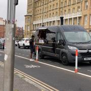 A pizza van parked by the cycle lane near Hove seafront