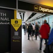 Woman breaks through security door and assaults airport worker to get on flight