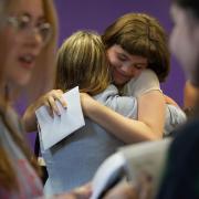 Students congratulate each other receiving their GCSE results at Roedean School