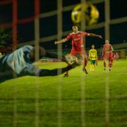 Joe Shelley scores from the penalty spot against Ashford Unied. Picture by Andy Schofield