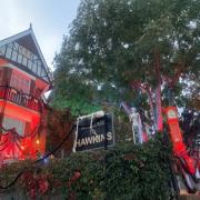The house is decorated in a Stranger Things theme, with a sign saying Welcome to Hawkins