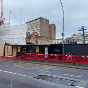 The shopfront of the former Marks and Spencer store has been partially demolished as work continues to build a new student housing block