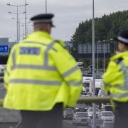 Two men have been arrested after being stopped on the M25 following reports of children entering a car near a hotel housing asylum seekers: credit - PA