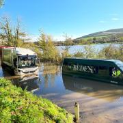 A Bede's School minibus was stranded leaving school children to wade through the water Credit Lucy Kennedy
