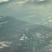 Plane passenger Mike Bruno captured this picture of Brighton covered in snow from thousands of feet in the air