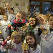 Lizzie Baily, centre, with children from the creative art workshops