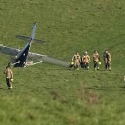 Firefighters were seen near the aircraft following the crash