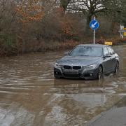 Cars drove through deep flood water in Hellingly