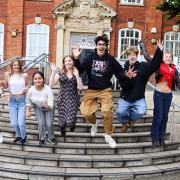Students at Bhasvic celebrate after inspection results