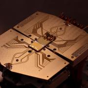 Quantum computer setup at the University of Sussex with two quantum computer microchips where quantum bits are transferred from one microchip to another with record speed