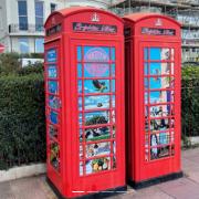 Two of the classic phone boxes on Marine Parade