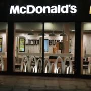 Forensics officers in the Worthing McDonald's on Monday