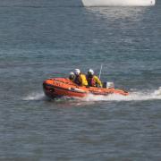 RNLI crews saved two children from an inflatable kayak as it was blown out to sea