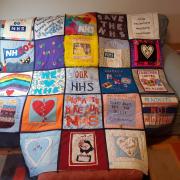 A quilt with messages of support for the NHS
