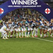 Carl Rushworth (dark blue shirt, centre, back) and England Under-21s celebrate Euro glory