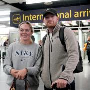 Hannah Dolman and Dominic Doggett arrive on a flight from Rhodes in Greece into Gatwick Airport