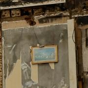 Martin's picture captured the painting amid damaged hotel