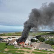 The blaze at the Harvester in Littlehampton. The neighbouring Windmill Entertainment Centre was damaged by smoke and water used to put the fire out