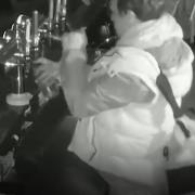 A burglar was caught on CCTV pouring himself a pint