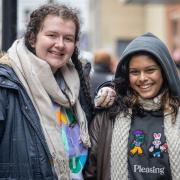 Friends Holly Pethybridge and Fahima Begum, holding a hand warmer, at the queue,