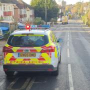 Updates after car crashes into power cable - road closed