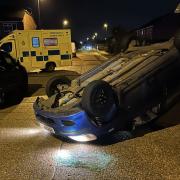The car was on its bonnet in Hurstfield Road, Lancing