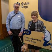 Maria Caulfield, right, met with guide dogs and cane users