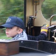 Ben behind a locomotive on the Evesham Vale Light Railway aged five