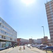 A woman has died after falling from some flats in Queensway, Bognor