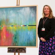 Jo Taswell pictured with her winning artwork