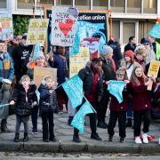 Parents protested outside Hove Town Hall over the plans to close schools in Brighton
