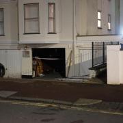 A car has hit a building in Eastbourne