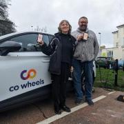 Councillor Jim Murray with Jill Shacklock, director at Eastbourne Eco Action Network, in front of one of the cars in the scheme