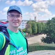 Dr Sam Cosham on a previous walk in Canterbury, about to start the last leg of the North Down's Way.