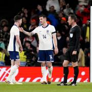 Lewis Dunk talks things over with Declan Rice during England's defeat to Brazil