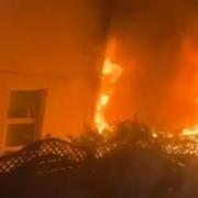 Crews tackle fire that spread from garden to house