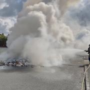 Smoke billows as firefighters tackle bin lorry blaze