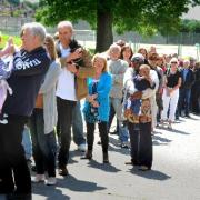 The queue for tickets to the Olympic Torch relay celebration concert snakes out of Portslade Sports Centre