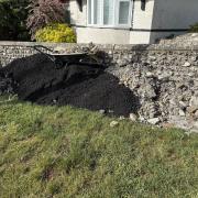 Roadworks rubbish against a wall in Mile Oak Road Portslade - Image by Sarah Booker-Lewis Local Democracy Reporting Service