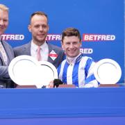 Oisin Murphy (right) during the presentation for the Betfred Diomed Stakes after a winning ride on Seagulls Eleven at Epsom