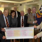 David Dunnigan, right, donates £3,000 on behalf of the Sussex Masonic Charities to the Royal Sussex Regiment