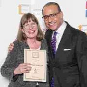 Steph Savill receives her winning certificate from Theo Paphitis