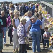 Thousands of bunches of flowers have been left on the Shoreham Tollbridge.  Picture: Terry Applin