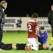 John Pike is treated on the pitch. Pictures by Joe Knight.