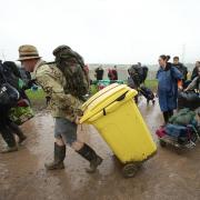 Festivalgoers arrive for the Glastonbury festival at the Worthy Farm site, Somerset