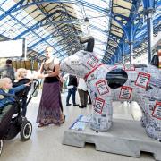 Children are intrigued by The Argus Newshound, the Snowdog which is inside Brighton Railway Station Picture: Simon Dack